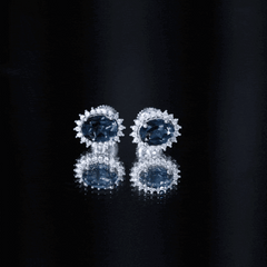 Oval Shaped 2.2 Carat London Blue Topaz Stud Earrings with Moissanite Halo