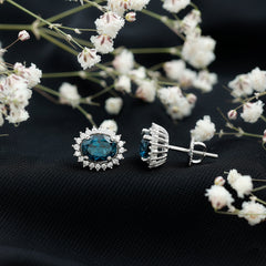 Oval Shaped 2.2 Carat London Blue Topaz Stud Earrings with Moissanite Halo