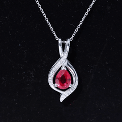 Pear Cut Created Ruby Teardrop Pendant with Moissanite Accent