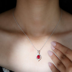 Pear Cut Created Ruby Teardrop Pendant with Moissanite Accent