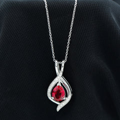 Pear Cut Created Ruby Teardrop Pendant with Moissanite Accent