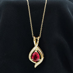 Pear Cut Created Ruby Teardrop Pendant with Moissanite Accent