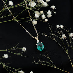 Oval Created Emerald and Moissanite Solitaire Pendant