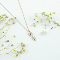 Minimal Moissanite Infinity Knot Pendant Necklace