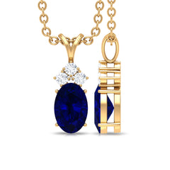 Natural 0.6 Carat Oval Blue Sapphire Pendant Necklace with Diamond Trio