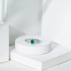 Designer Emerald Oval Engagement Ring with Diamond Halo