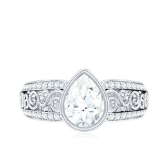 Bezel Set Moissanite Pear Engagement Ring with Filigree Details