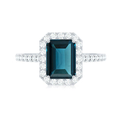 6X8mm Emerald Cut London Blue Topaz Engagement Ring with Diamond Halo