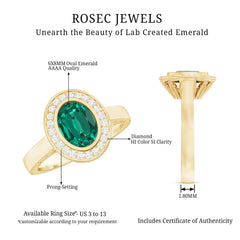 6X8 mm Oval Lab Grown Emerald Bezel Set Engagement Ring With Diamond Halo