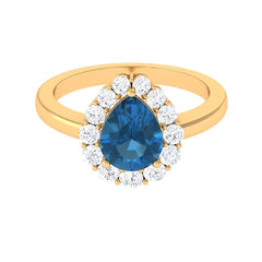 7x10mm Pear Shape London Blue Topaz Halo Engagement Ring with Diamond