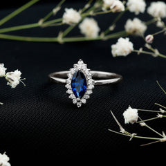 Marquise Cut Lab Grown Blue Sapphire and Diamond Halo Engagement Ring