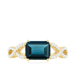 6X8mm Emerald Cut London Blue Topaz East West Engagement Ring with Diamond