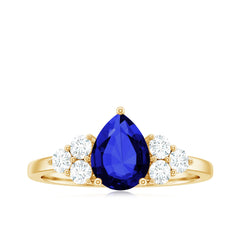 Certified 1.6 Carat Lab Grown Blue Sapphire Pear Engagement Ring with Diamond Trio
