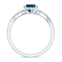 6X8mm Oval Cut London Blue Topaz and Diamond Bypass Engagement Ring