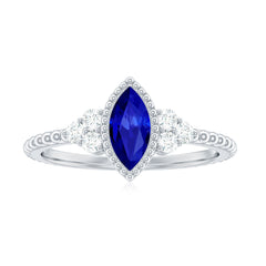 Vintage Style 0.7 Carat Lab Grown Blue Sapphire Marquise Engagement Ring with Diamond Trio