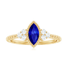 Vintage Style 0.7 Carat Lab Grown Blue Sapphire Marquise Engagement Ring with Diamond Trio