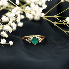 Oval Shaped Emerald Celtic Engagement Ring in Bezel Setting