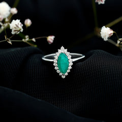 Elongated Marquise Cut Emerald Engagement Ring with Diamond Halo