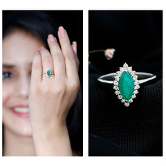 Elongated Marquise Cut Emerald Engagement Ring with Diamond Halo