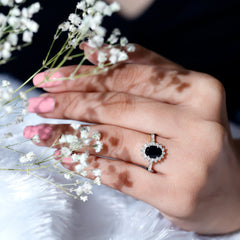 Oval Cut Lab Grown Black Diamond and Diamond Halo Engagement Ring