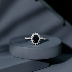 Oval Cut Lab Grown Black Diamond and Diamond Halo Engagement Ring