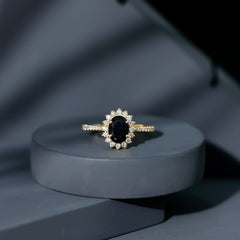 Oval Cut Lab Grown Black Diamond and Diamond Halo Engagement Ring