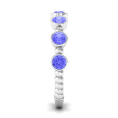 Natural Tanzanite Half Eternity Ring in Bezel Setting