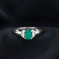 Oval Cut Emerald Solitaire Engagement Ring with Bow Design