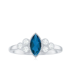 London Blue Topaz Marquise Engagement Ring with Diamond Trio
