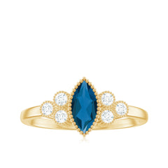 London Blue Topaz Marquise Engagement Ring with Diamond Trio