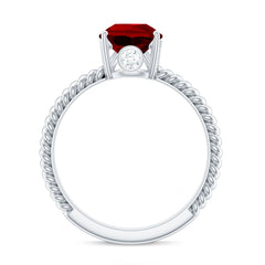 Pear Cut Created Ruby Solitaire Ring with Hidden Moissanite