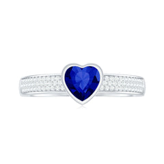 Heart Shape Created Blue Sapphire Solitaire Ring with Diamond Side Stone