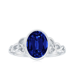 Certified 4 Carat Oval Lab Grown Blue Sapphire Bezel Set Engagement Ring