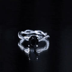 Oval Shaped 7X9MM Black Onyx and Diamond Braided Engagement Ring