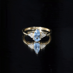 1 Carat Aquamarine Pear Engagement Ring with Diamond Trio