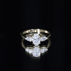 Oval and Pear Cut Moissanite Three Stone Engagement Ring
