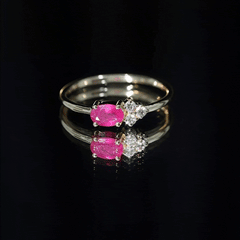 East West Style 0.6 Carat Oval Ruby Promise Ring with Diamond Trio