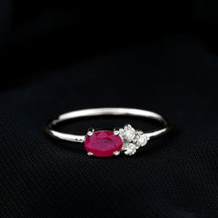 East West Style 0.6 Carat Oval Ruby Promise Ring with Diamond Trio