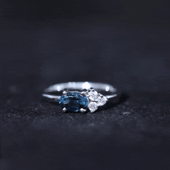 4X6mm Oval Cut London Blue Topaz East West Promise Ring with Diamond Trio