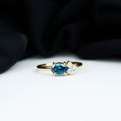 4X6mm Oval Cut London Blue Topaz East West Promise Ring with Diamond Trio
