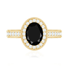 Vintage Inspired Black Onyx Oval Engagement Ring with Diamond Halo