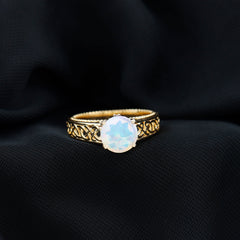 Ethiopian Opal Celtic Knot Engagement Ring with Surprise Diamond