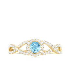 Aquamarine Criss Cross Engagement Ring with Diamond Halo