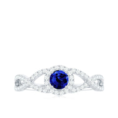 Certified 0.6 Carat Lab Grown Blue Sapphire Crossover Engagement Ring with Moissanite