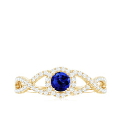Certified 0.6 Carat Lab Grown Blue Sapphire Crossover Engagement Ring with Moissanite