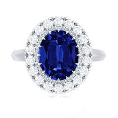Certified 4 Carat Lab Grown Blue Sapphire Oval Engagement Ring with Diamond Halo
