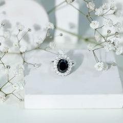 Oval Lab Grown Black Diamond and Moissanite Halo Engagement Ring