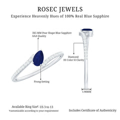 Tilted Pear Cut Blue Sapphire Solitaire Bypass Ring with Diamond