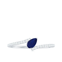 Tilted Pear Cut Blue Sapphire Solitaire Bypass Ring with Diamond
