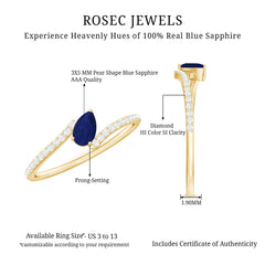 Tilted Pear Cut Blue Sapphire Solitaire Bypass Ring with Diamond